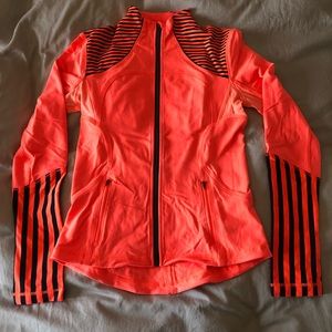 Lululemon orange and black zip up jacket. Size 6.